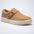 Tan sneaker with a buckle on a white background