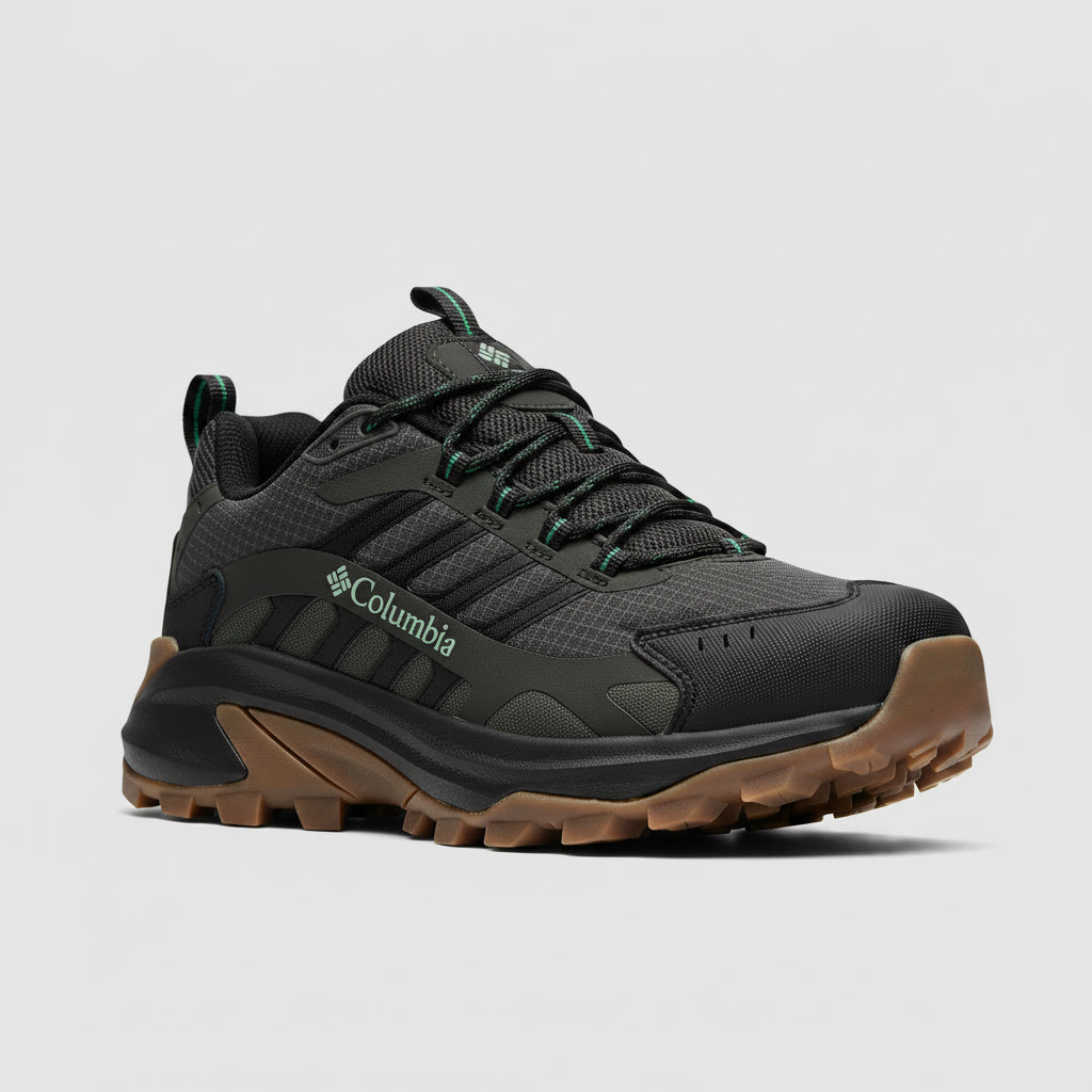 Columbia hiking shoe with brown sole on a red and black striped background