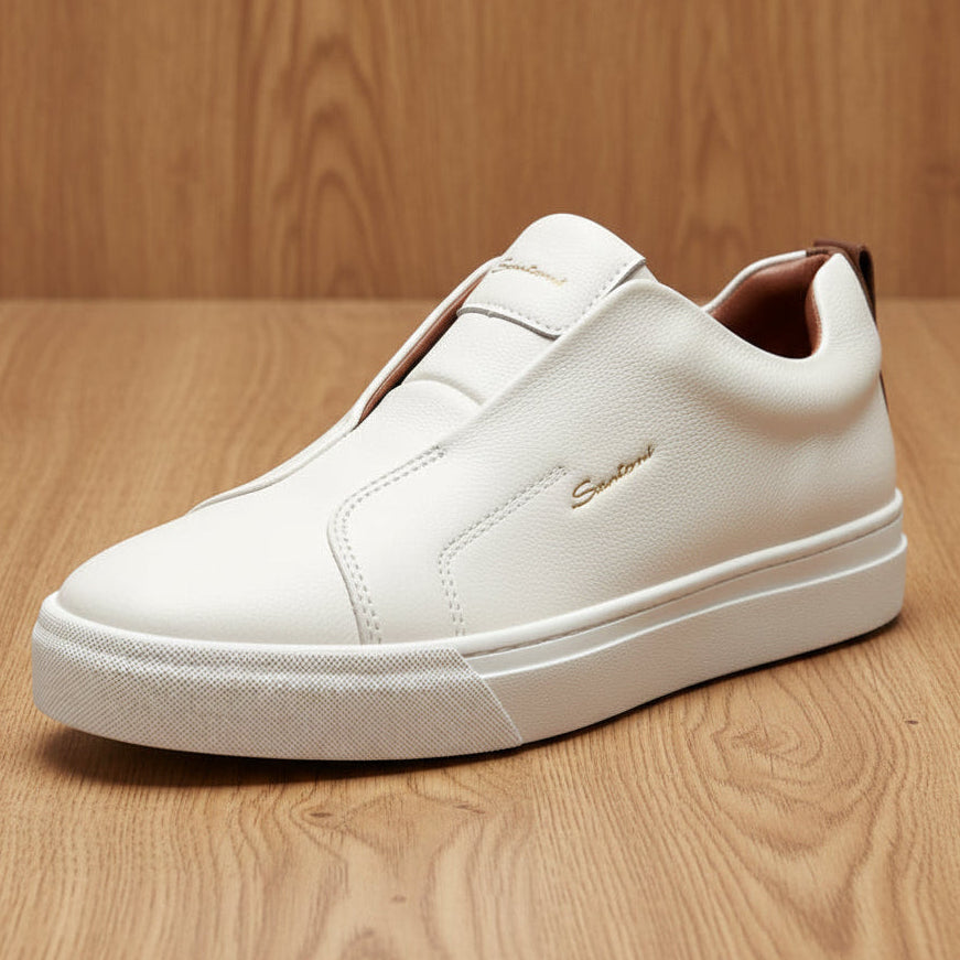 White slip-on sneakers with brown accents on a light gray background