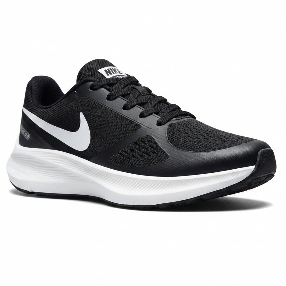 Black and gray running shoe with white Nike logo on a light gray background